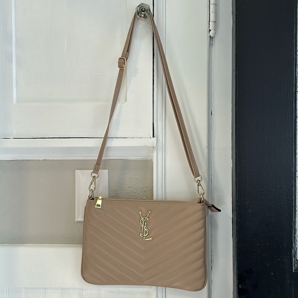New without tags, bone color, cross body with card slots.